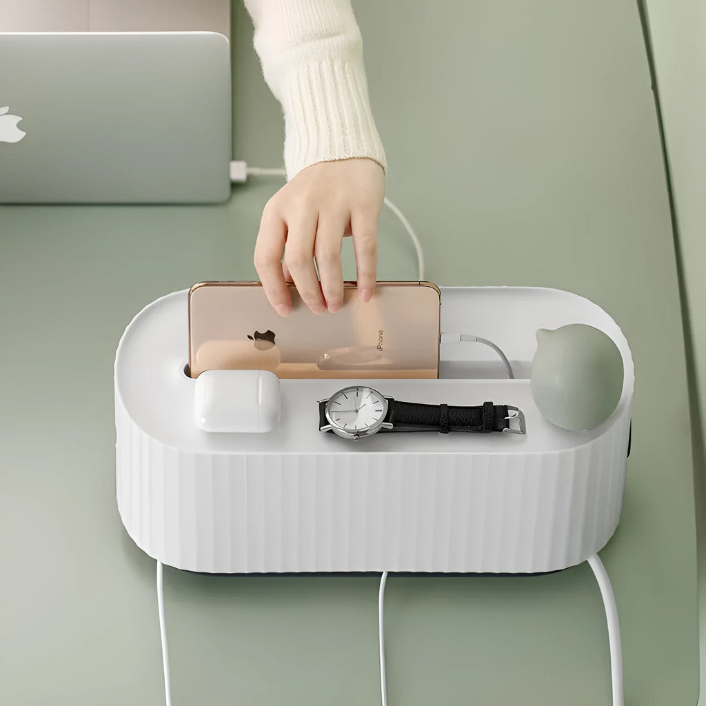 Blue and white power strip storage box with lid showing cable holes and internal phone slot