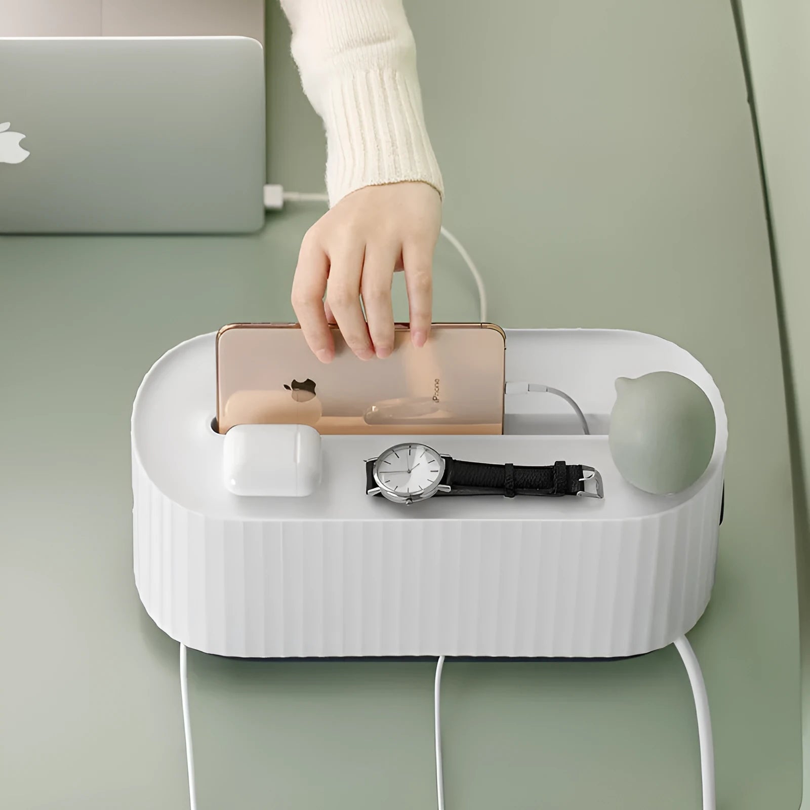 Blue and white power strip storage box with lid showing cable holes and internal phone slot