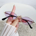 Small cat eye sunglasses with metal frame and rhombus temple design in gold with grey lenses