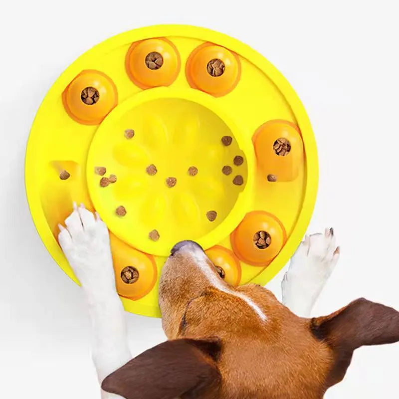 Square green interactive dog puzzle feeder bowl with central column and top turntable on a non-slip base.