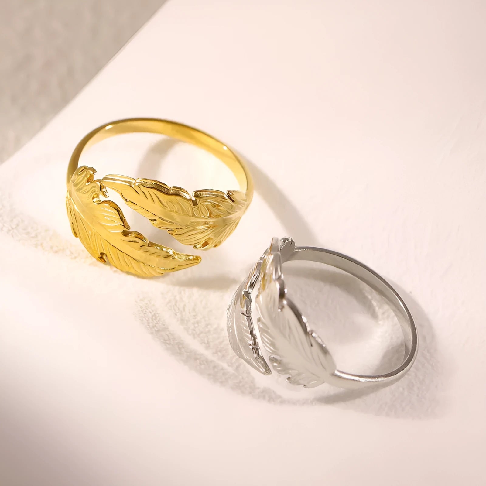 Women's adjustable opening feather fashion ring in silver or gold colour on titanium steel.