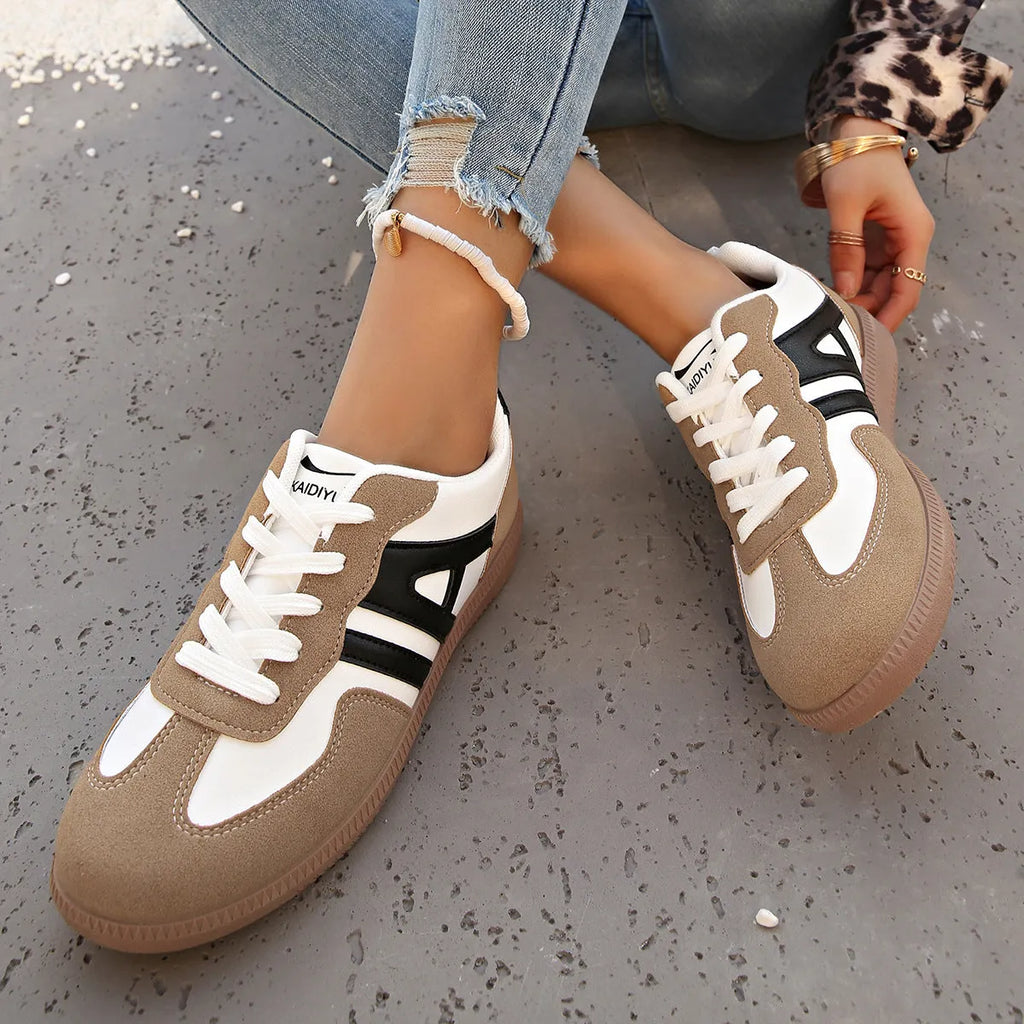 Women's retro colour matching lace-up casual trainers with a low platform heel in black, grey, or khaki.