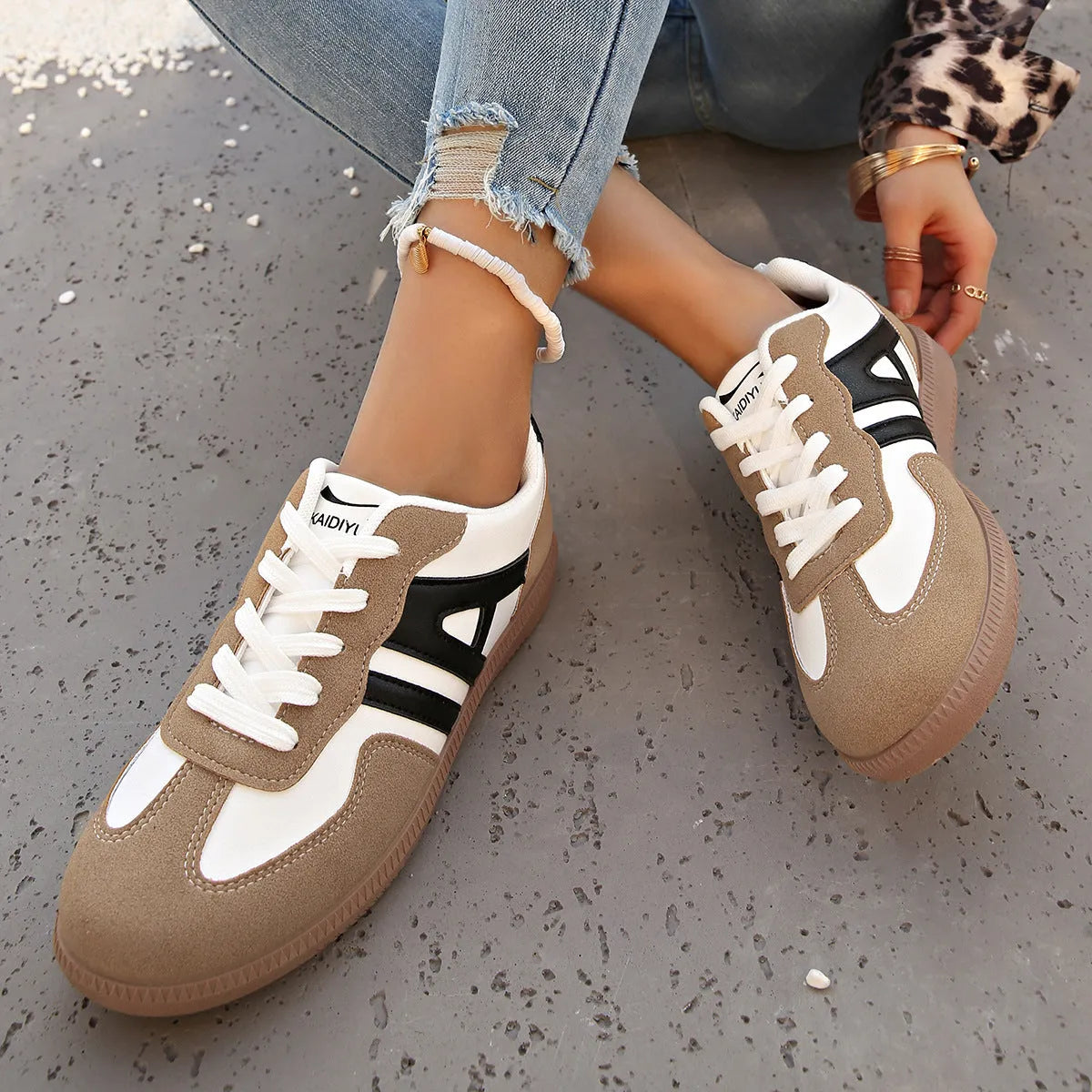 Women's retro colour matching lace-up casual trainers with a low platform heel in black, grey, or khaki.