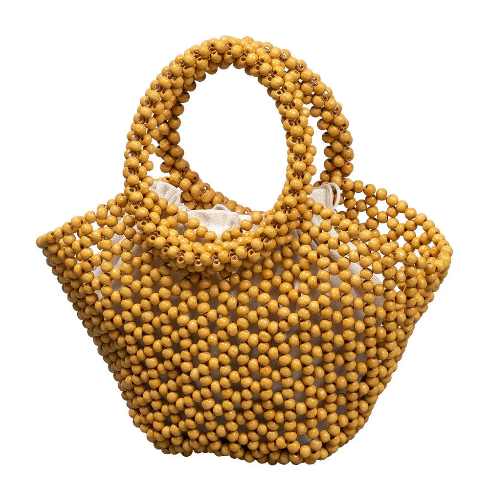 Hand-woven maple wood beach bag with wooden beads in dumpling shape.