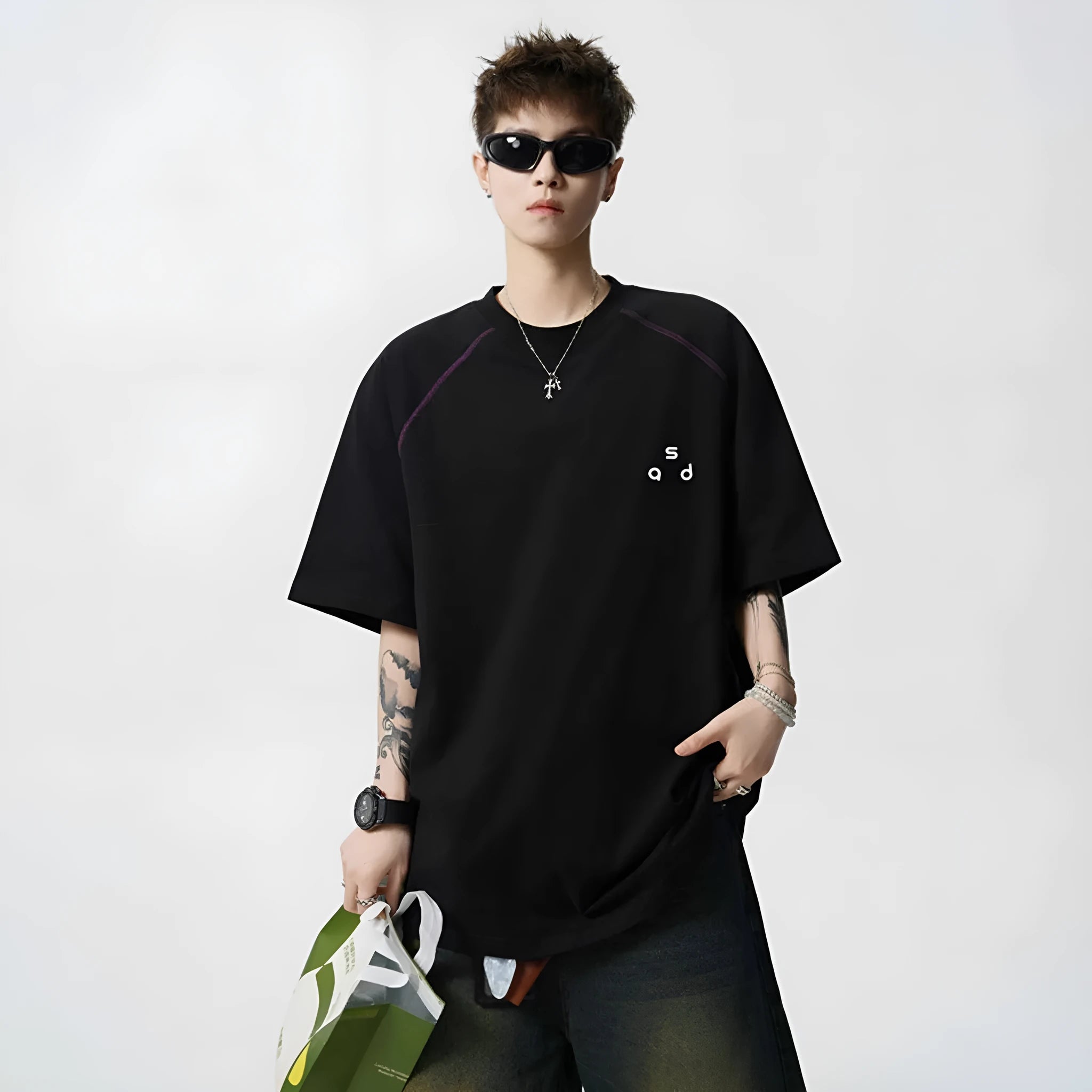 Men's loose fit black cotton T-shirt with a printed letter design on the front.