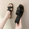Women's PVC cross strap toe ring flip flops in light blue on a white background.