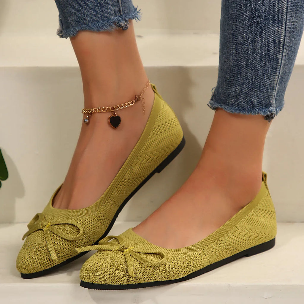 Women's knitted bow loafers with pointed-toe design in multiple colour options showing flat heel and rubber sole