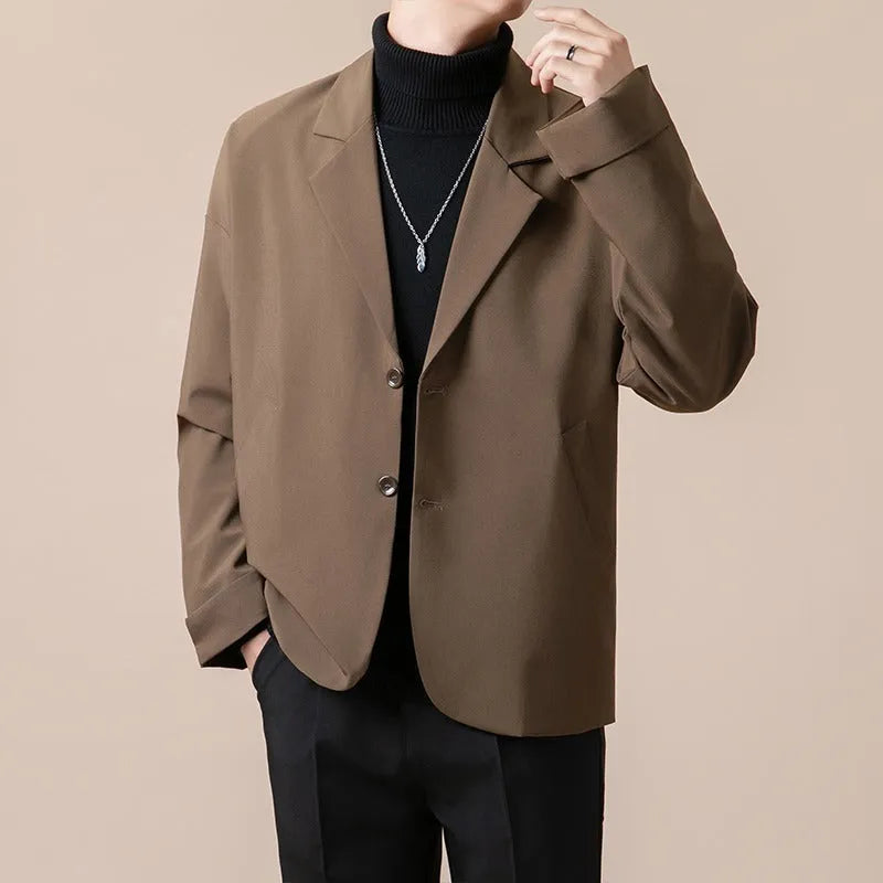 Casual loose fit suit jacket in chemical fibre blend, shown in one of four colours with regular length and long sleeves.