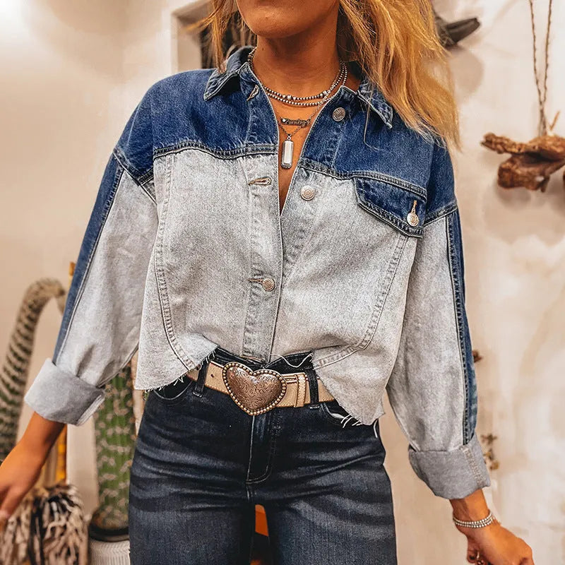 Women's loose fit denim coat with a row of silver buckle closures on the front.