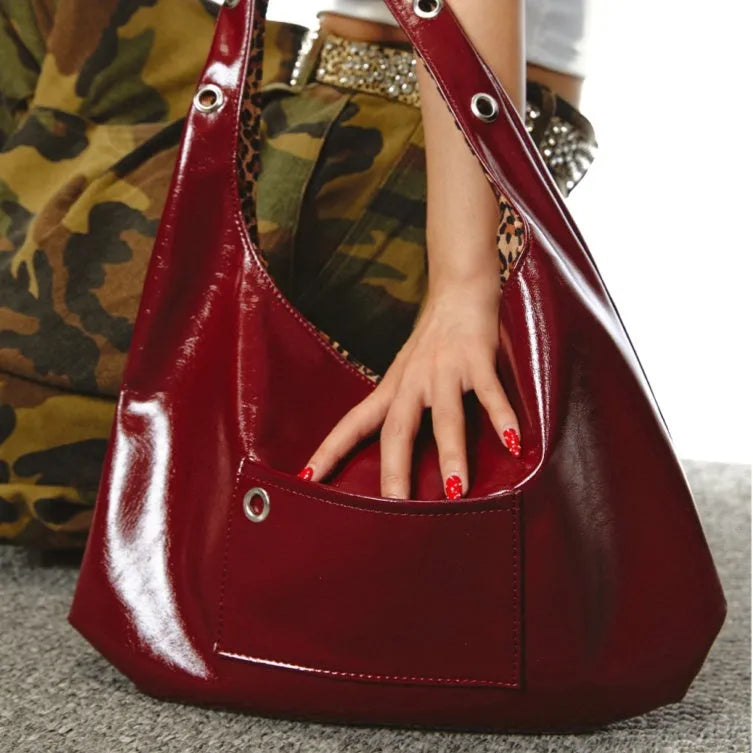 Red leopard print women's shoulder bag with dumpling shape, showing two compartments and shoulder strap