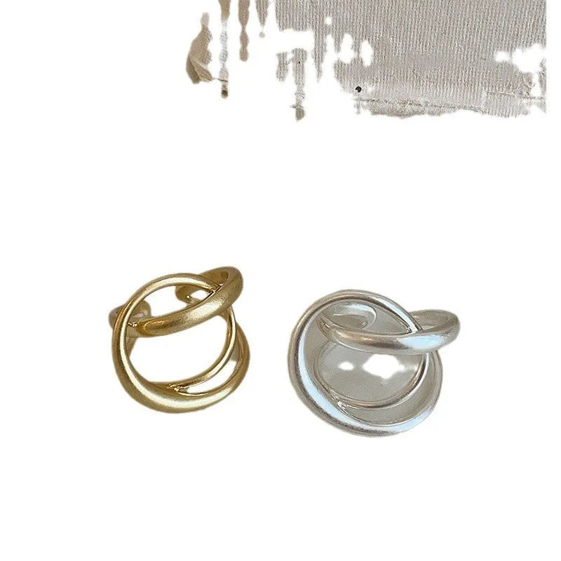 Women's geometric open ring with interlaced pattern, matte finish, adjustable band for sizing flexibility