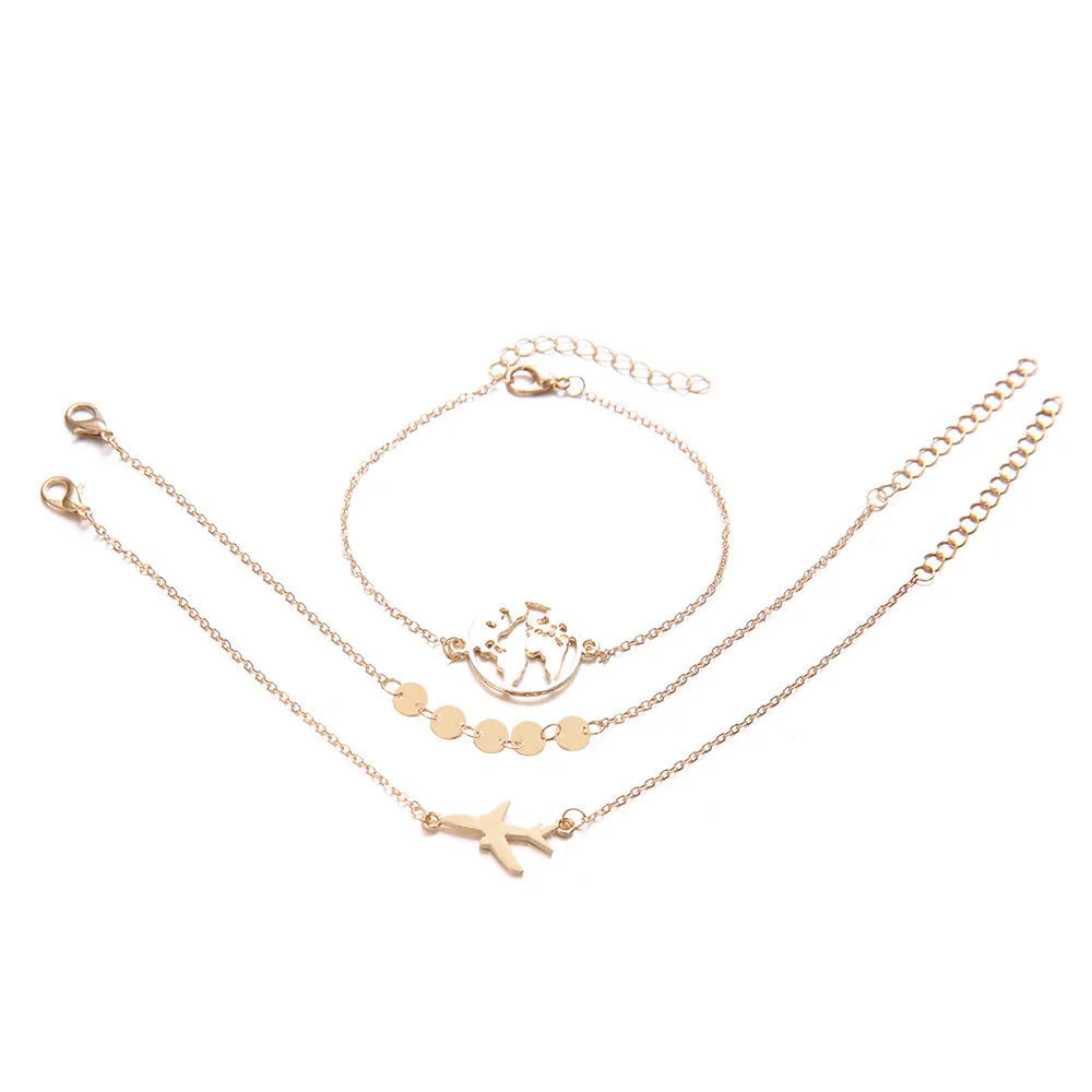 Three bohemian bracelets with heart-shaped alloy charms showing aircraft map designs in sku2104 colour.