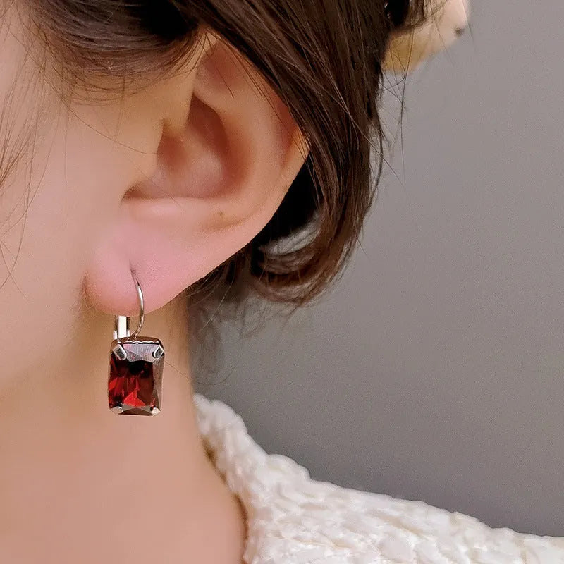 Women's square crystal earrings with copper frame in purple, red and yellow colours