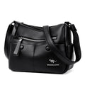 Women's soft leather crossbody bag in horizontal square shape with stitching details and crossbody strap
