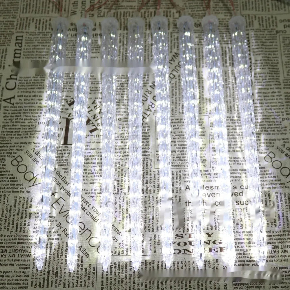 LED ice cone-shaped meteor shower garden light with remote control on a bracket.