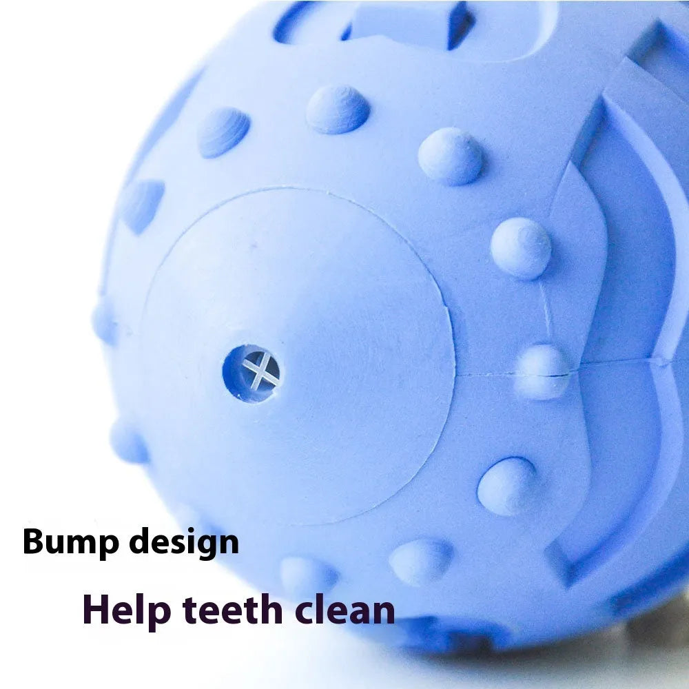 Light green rubber rugby ball dog toy with bite-resistant texture for interactive play and teeth cleaning.