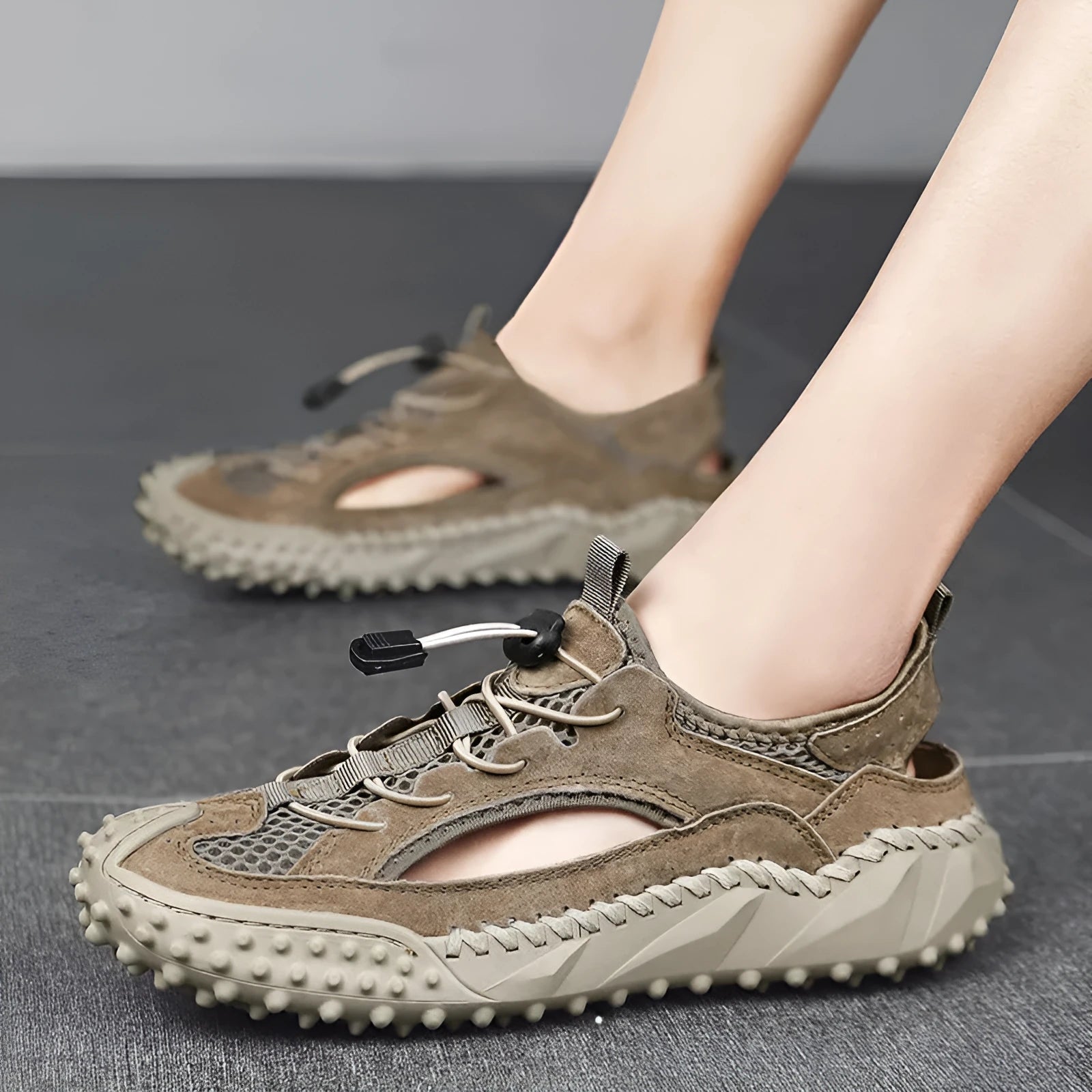 Men's waterproof sports sandals with leather mesh upper and rubber sole in toe-cap design