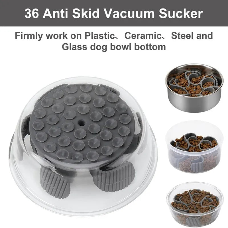 Red silicone dog slow feeder insert with spiral design and suction cups on a white background.