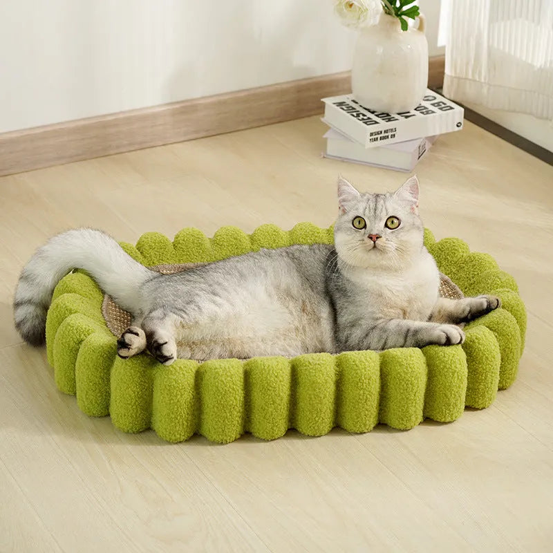 Green oval cat scratch pad bowl with sisal scratching surface measuring 65cm by 42cm