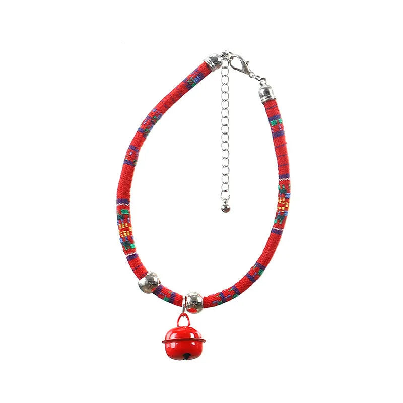 Adjustable dog collar with ethnic patterns and bell in black, blue, pink, red, or white colours, sizes S and L