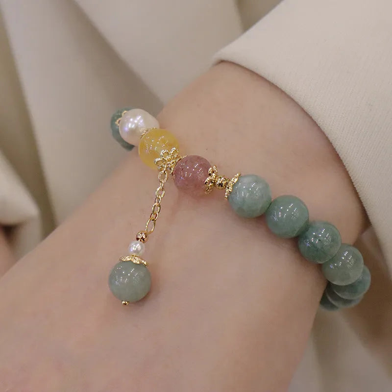 Green Myanmar jade beaded bracelet with pearls and 3D decoration in a geometric Han style design.