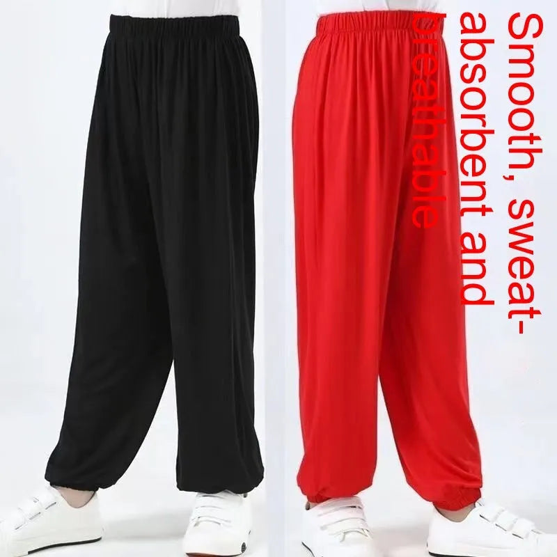 Black children's high-elasticity Lycra practice pants for Sanda martial arts training on a white background.