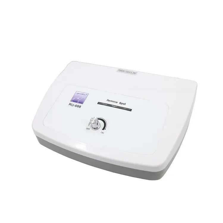 White professional spot and mole removal pen electronic beauty device with power adaptors.