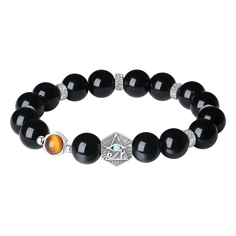 Men's S925 sterling silver bracelet with an 8mm geometric obsidian God's Eye centrepiece on a wrist.