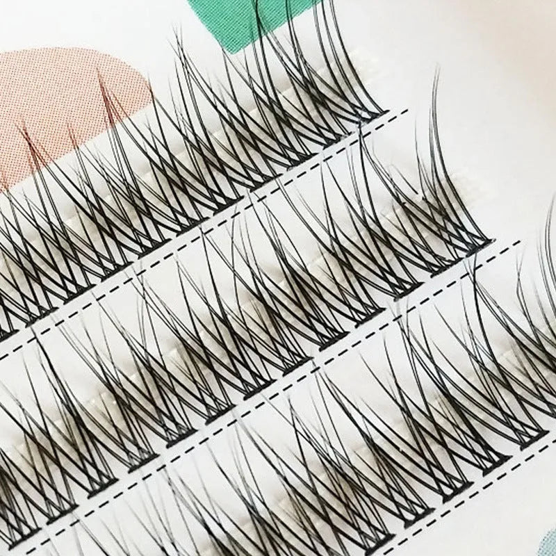 Black V-shaped fairy fishtail false eyelashes with thick segments on a clear band