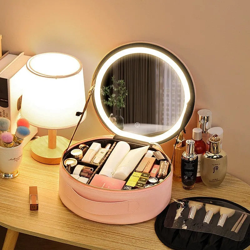 Round pink smart LED makeup bag with mirror lights open, showing internal partitions and adjustable lighting.