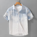 Man wearing a light pink loose-fit pure cotton short sleeve casual shirt for summer.