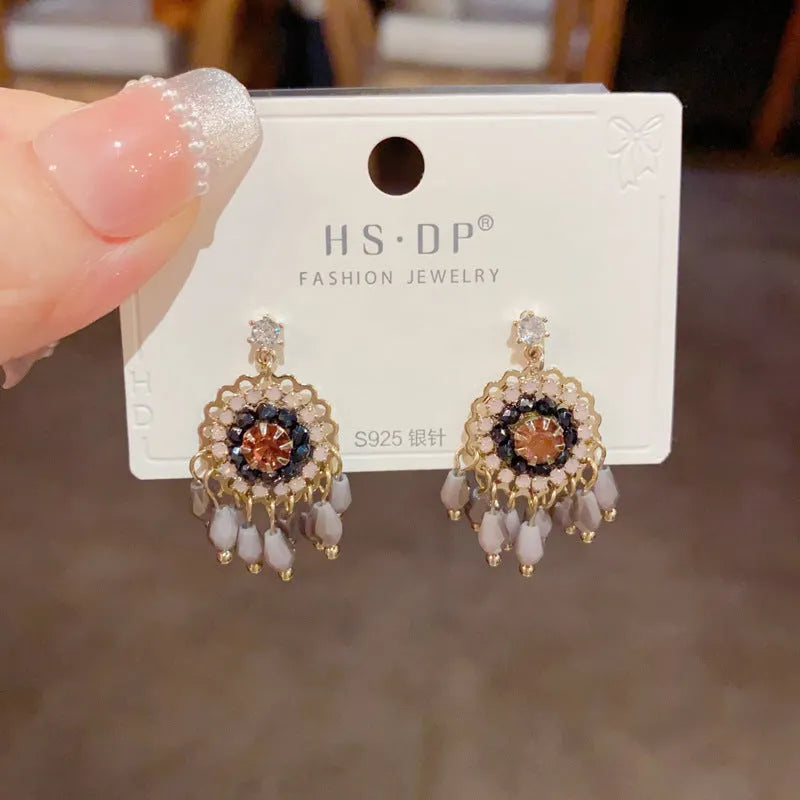 Purple and blue round crystal tassel earrings with diamond accents and thick gold plating