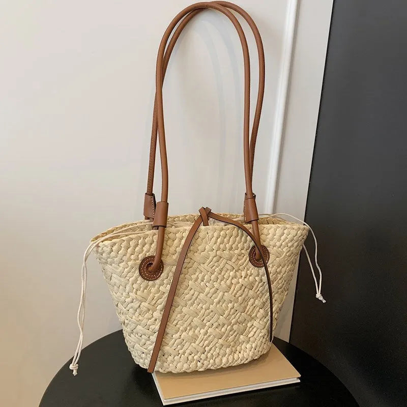 Large woven shoulder hand-carry bag in retro styling with horizontal square shape