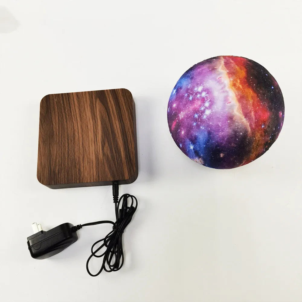 Magnetic levitation galaxy decorative light with 14cm moon lamp floating above walnut-coloured base