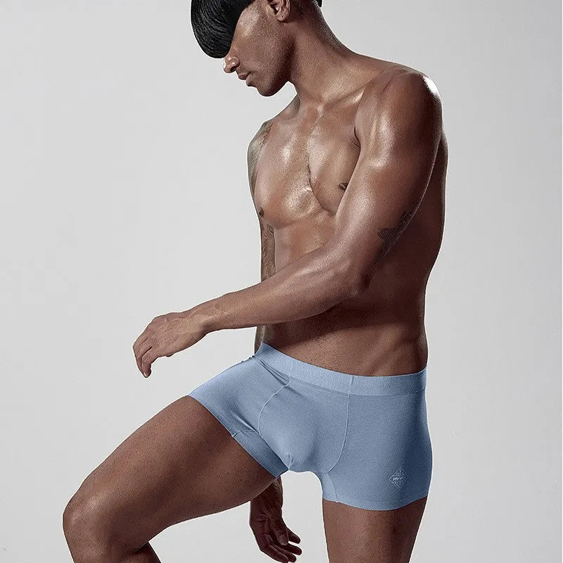 Men's seamless modal underwear in green colour showing mid-waist design and body shaping features