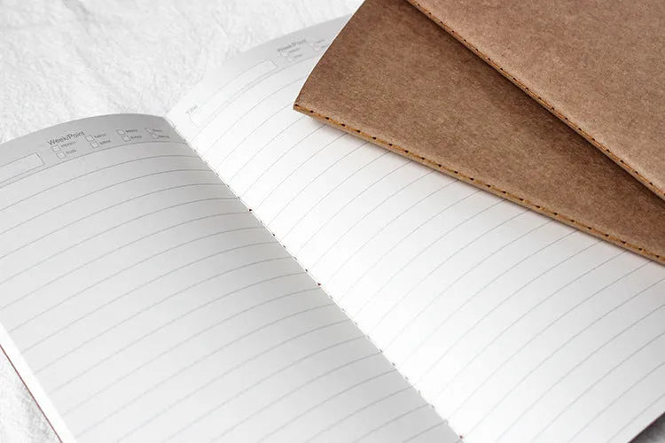 Cowhide diary refill inner core showing 11x21cm size and saddle stitch binding