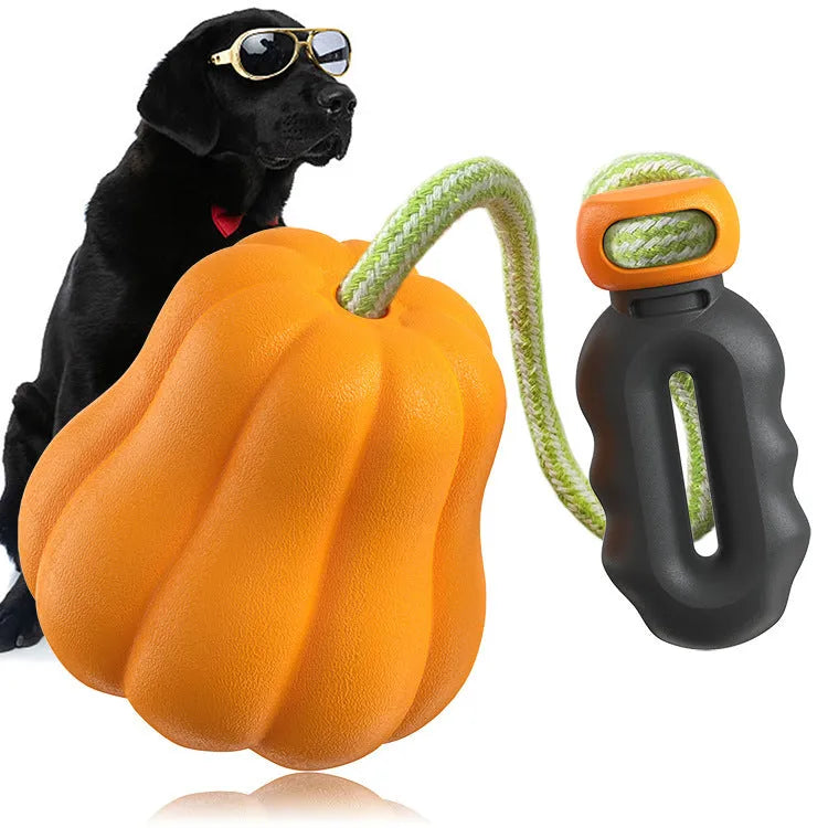 Orange pumpkin-shaped plastic dog toy measuring 10.3cm with optional rope attachment for fetch games