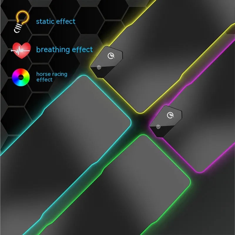 Large black gaming mouse pad with mech-style graphics on a desk, showing its non-slip rubber base and TYPC interface.