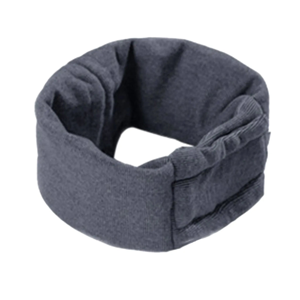 Dog wearing purple calming hoodie with ear muffs covering head and neck