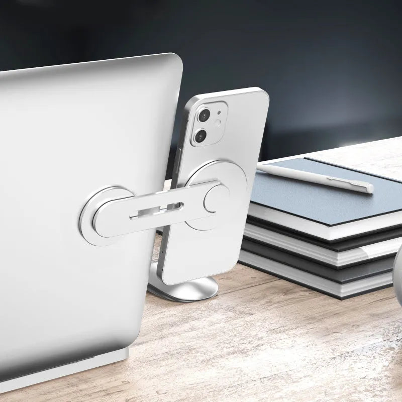 Silver magnetic phone holder for Tesla suspension screens showing 180-degree flip mechanism and aluminium alloy frame