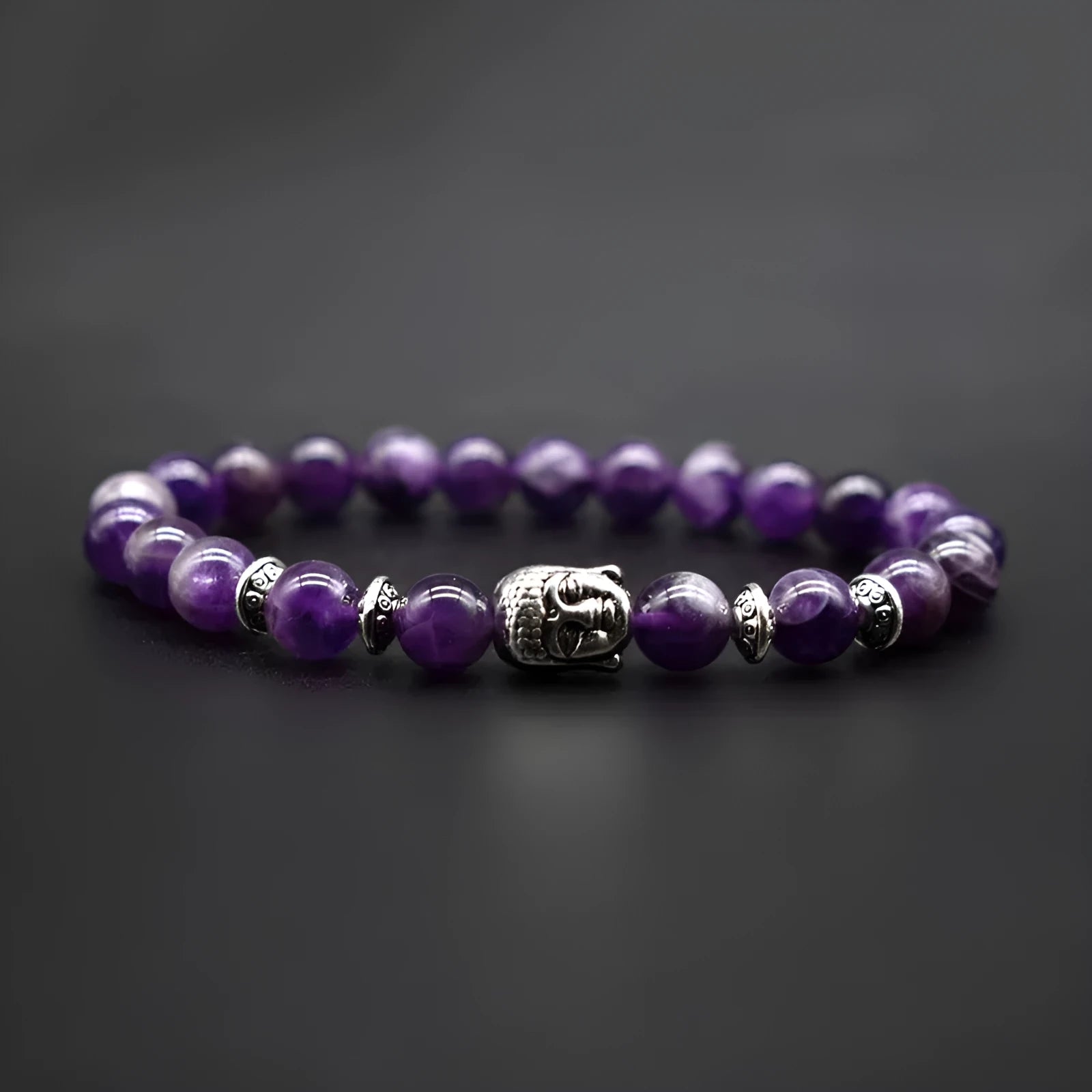 Handcrafted unisex bracelet with 19mm Buddha head beads in amethyst, tiger eye, black agate, pink crystal, and green gold options