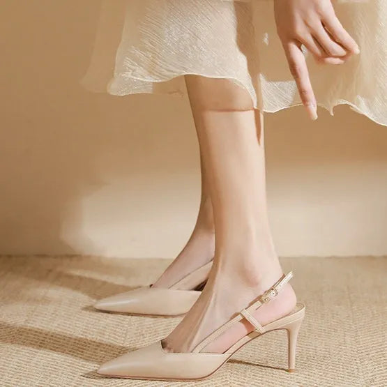 Apricot women's high-heeled sandals with a single thin strap and buckle fastening, shown on a foot.