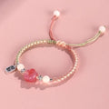 Red cat's paw couple bracelet with woven glass beads in handcrafted pastoral design
