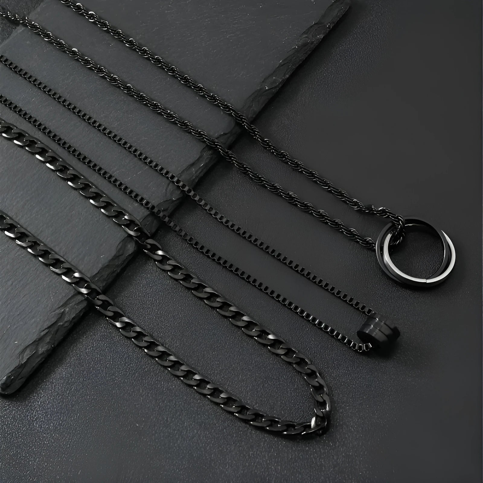 Black three-piece stainless steel men's necklace set with titanium steel cylindrical ring pendant