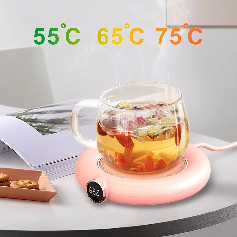 White USB cup warmer pad on desk with LED display showing temperature setting and mug on top