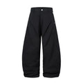 Men's black pleated machete casual trousers with a loose wide-leg fit on a neutral background.