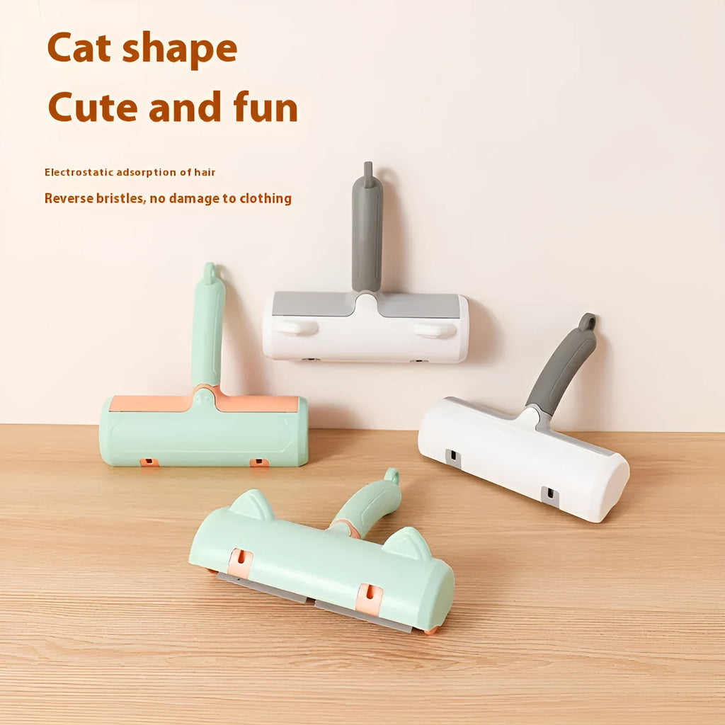 Mint green manual cat hair removal brush with detachable fur collection bin on a grey sofa