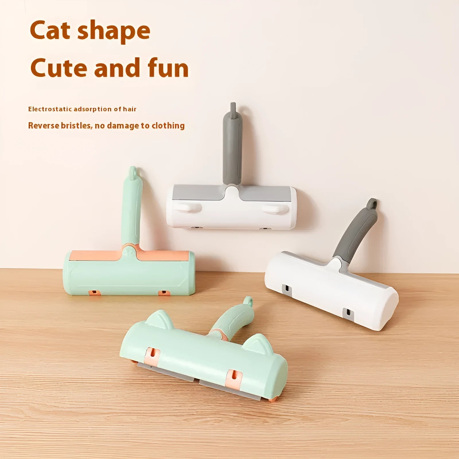 Mint green manual cat hair removal brush with detachable fur collection bin on a grey sofa