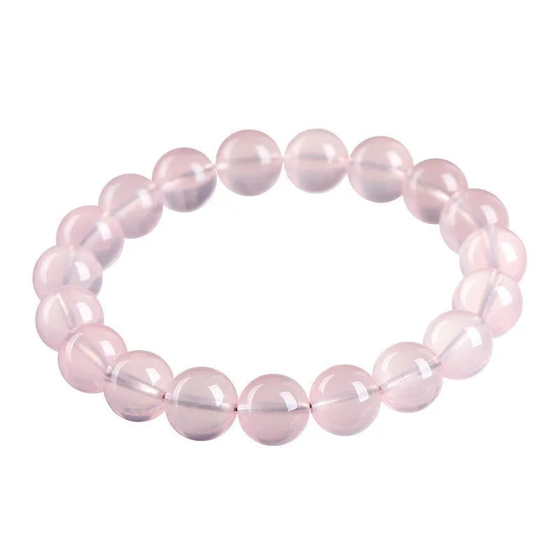 Natural crystal round beads bracelet with hand-polished finish in pink colour, showing seven size options from 6mm to 22mm diameter