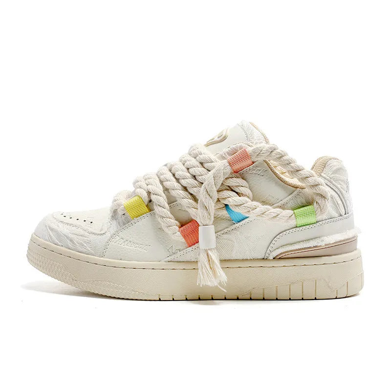 Creamy white retro skateboard shoes with low-top design, platform heel, and mesh lining details